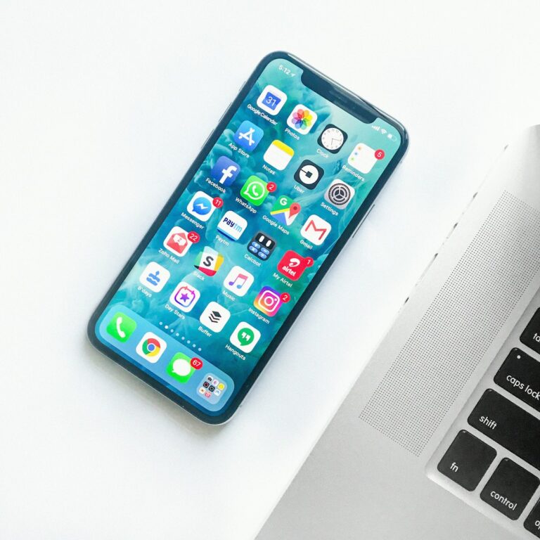 Smartphone resting on modern minimalist desk displaying productive mobile AI tools