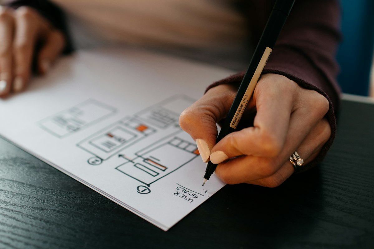 Designer using digital tablet and stylus creating eye-catching social media visual assets