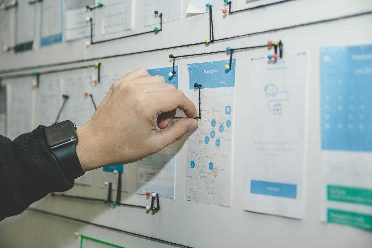 Real photo of a professional organizing roadmap milestones and action item cards on a project board